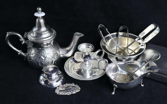 A silver cigarette box, sauce boat, inkwell and brandy label and sundry plated items.